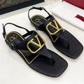 THONG SANDALS IN BLACK CALFSKIN WITH GOLD LOGO