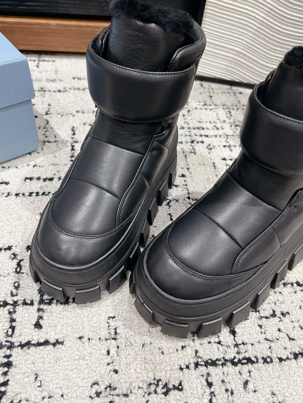 MONOLITH ANKLE BOOTS WITH STRAP IN BLACK CALFSKIN AND FLEECE LINING
